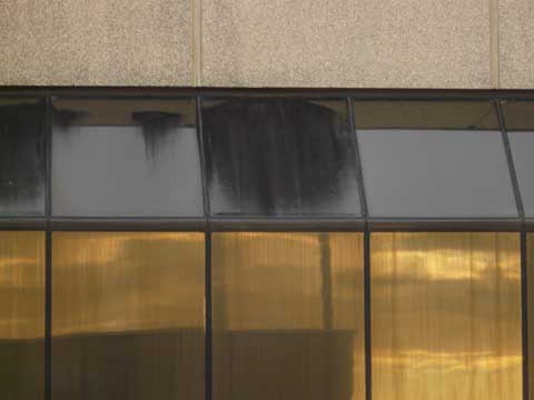 Pyrolitic glass coating fails quickly when subjected to washout from certain cladding materials.